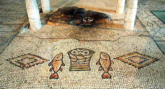 Mosaic of loaves and fishes with the sacred stone under the altar in the Church of the Loves and Fishes, Tabgha (on the Sea of Galilee), Israel